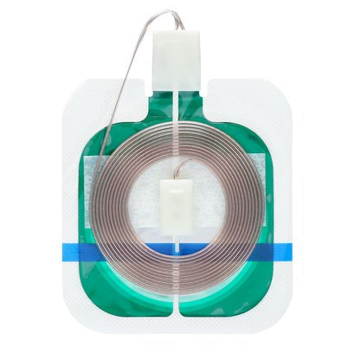 A green, square plastic container holds a brown ring; a white cap is attached to the top by a thin wire; it sits on a white background.