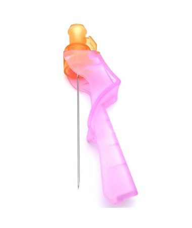 A pink and orange intravenous cannula extends a needle, lying on a white surface.