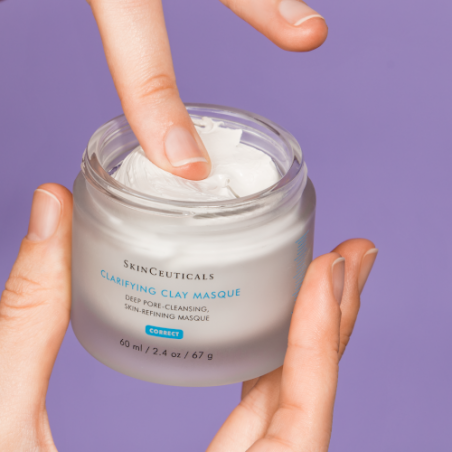 SkinCeuticals Clarifying Clay Masque jar with white cream on purple background