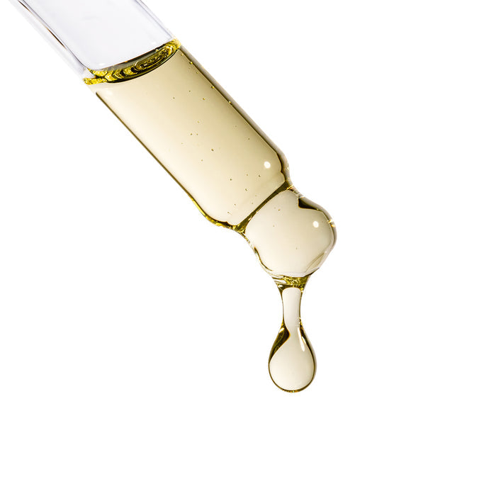 Golden hair oil droplet from Augustinus Bader The Hair Oil