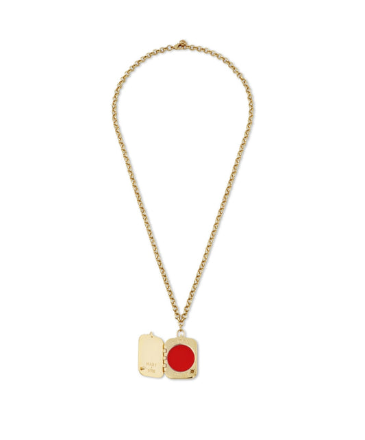 HART x RMS: Lip2Cheek Locket featuring a gold chain with an open locket holding a vibrant red lip and cheek color, combining clean beauty and elegant sustainable packaging.