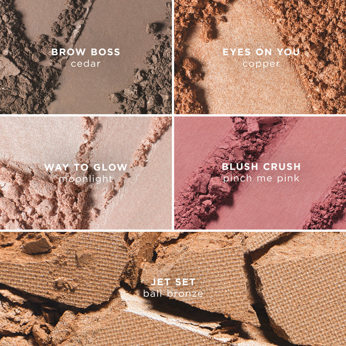 A macro collage of five crushed makeup powders, each labelled with its product name and shade. The top left shows a taupe-brown brow powder labelled “Brow Boss – cedar.” The top right features a shimmering copper eyeshadow labelled “Eyes On You – copper.” The middle left shows a soft champagne highlighter labelled “Way to Glow – moonlight.” The middle right displays a matte rosy pink blush labelled “Blush Crush – pinch me pink.” The bottom section shows a warm bronze powder labelled “Jet Set – B