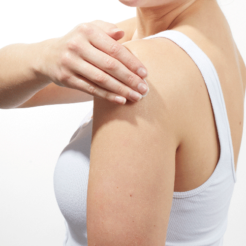 GIF of Models shoulder while wearing a white tank top and applying Beekman 1802's Lilac Dream Whipped Body Cream to her arm and rubbing it down.