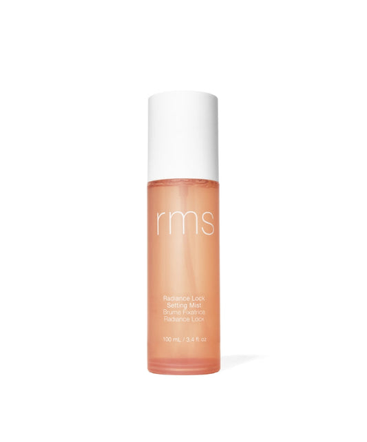 Radiance Lock Setting Mist in a sleek frosted bottle with white cap, featuring a glowing peach tone, designed for clean beauty and skincare infused makeup.