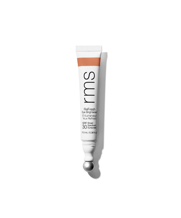 Tube of RMS Beauty ReFresh Eye Brightener Broad Spectrum SPF 30 + Correcting Tint with a metallic applicator ball on a white background, showcasing clean beauty packaging.