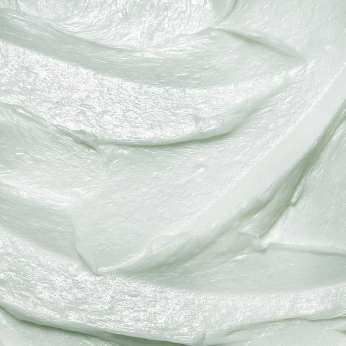 Smooth, light mint-green creamy texture of Tropic Rinse and Retreat Sensitive Body Wash, showing its rich, hydrating consistency.