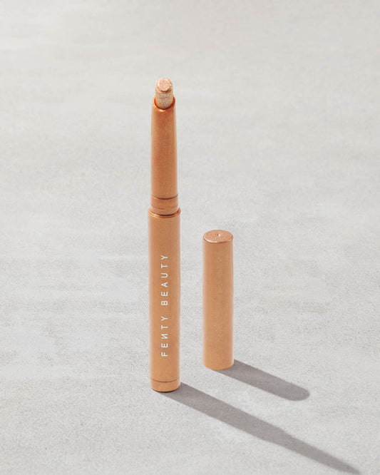 Open shot of Shadowstix Diamonds Diamond Veil Eyeshadow Stick in shade  Champion on a concrete background.