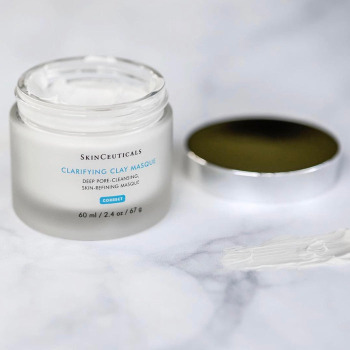 Open SkinCeuticals Clarifying Clay Masque jar with white clay cream and gold lid