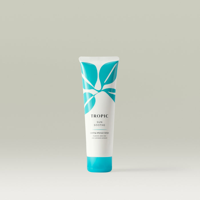 Tropic Sun Soothe Mini cooling aftersun lotion in a sleek white tube with turquoise leaf design, standing upright on a neutral background.